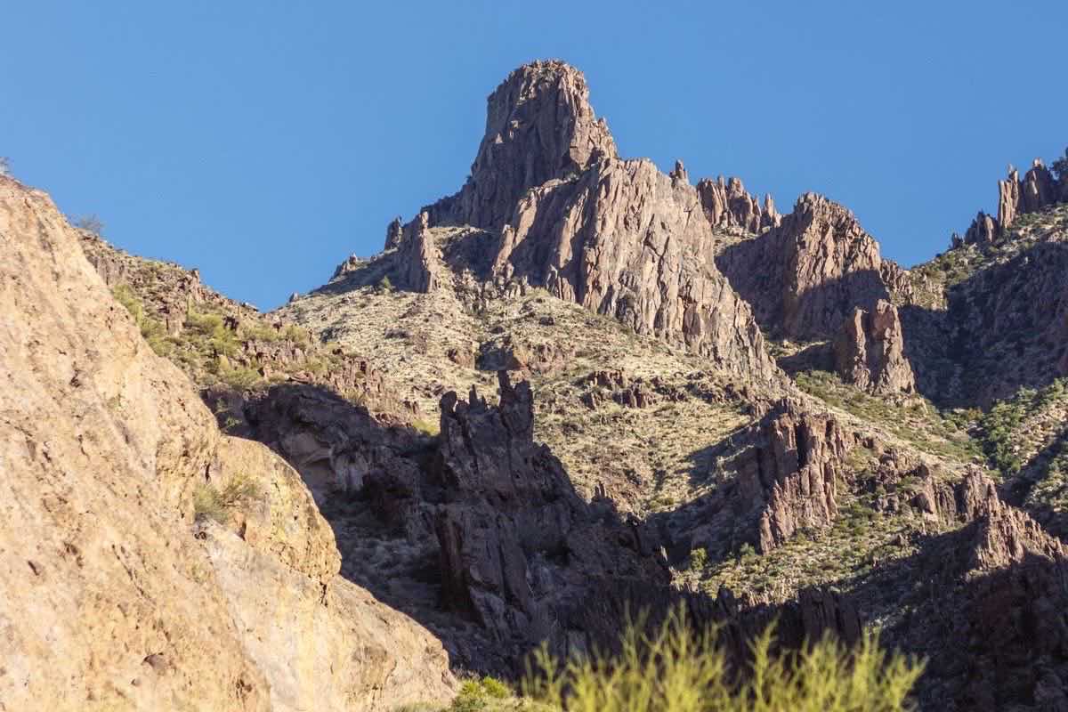 Rugged desert peaks and saguaro on a mountain slope
